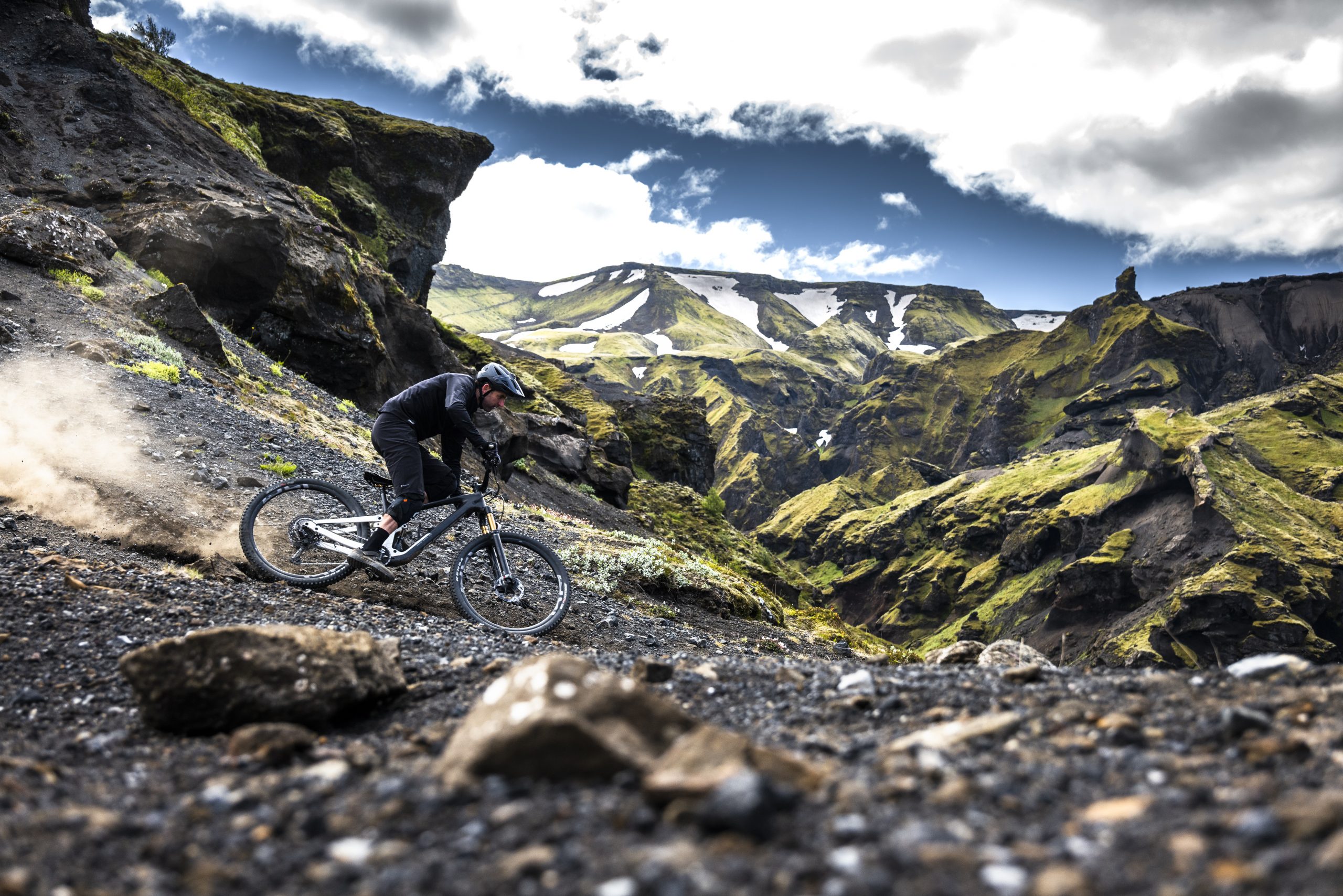 Mountain biking in rugged landscape, man on trail. Keywords: Andrew Neethling, Journey to The Centre of The Earth, adventure, exploration. Mountain Bike United.