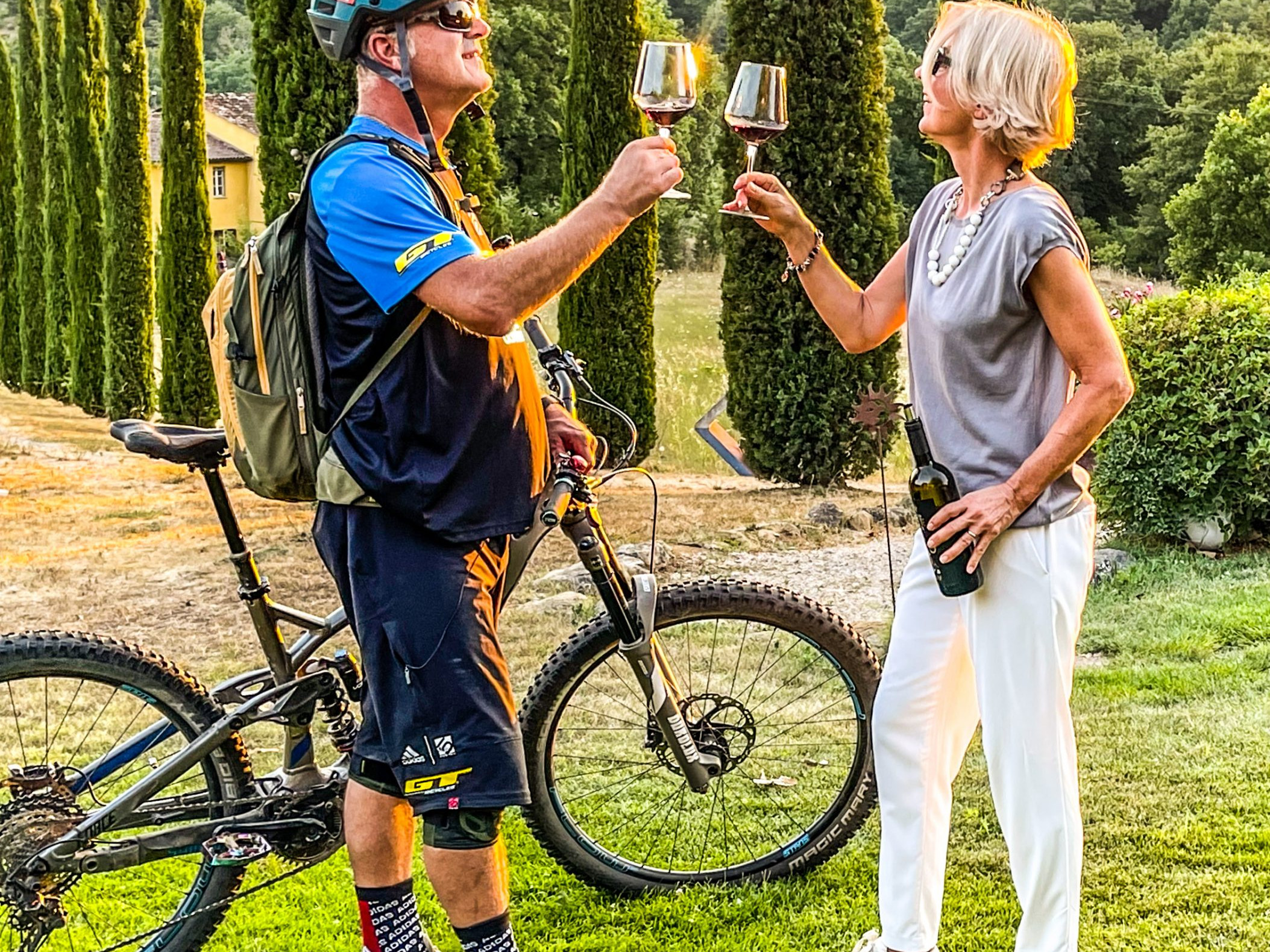 Hans Rey toasting with a woman in Umbria during 
