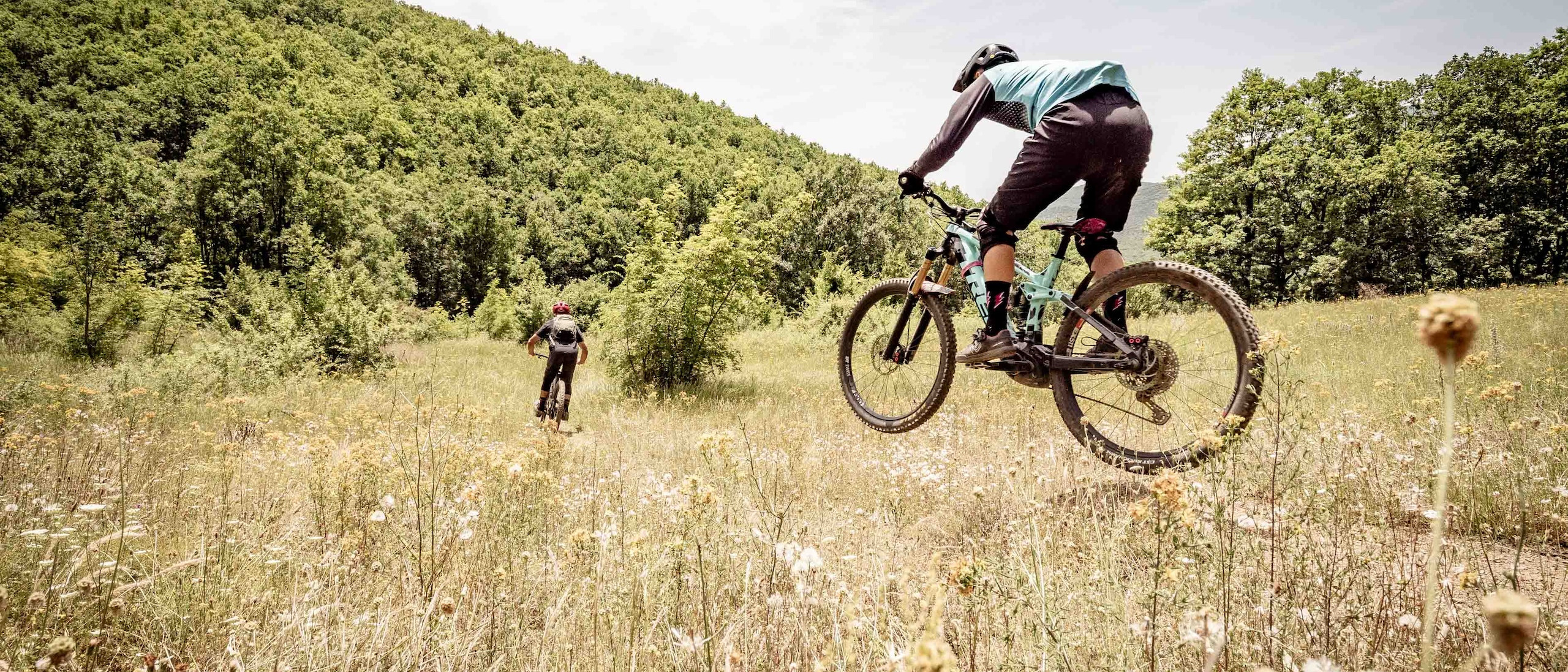 Two mountain bikers on the trails in Greece