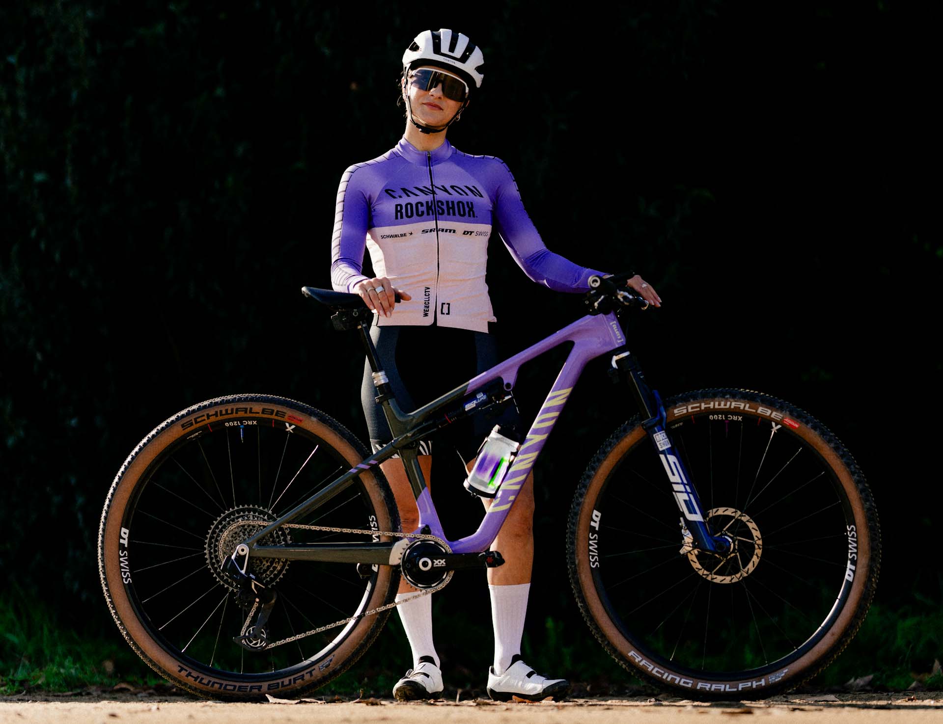 Cyclist with Canyon bike, wearing Canyon CLLCTV Factory XC Team jersey, possibly representing Jenny Rissveds. Mountain Bike United.