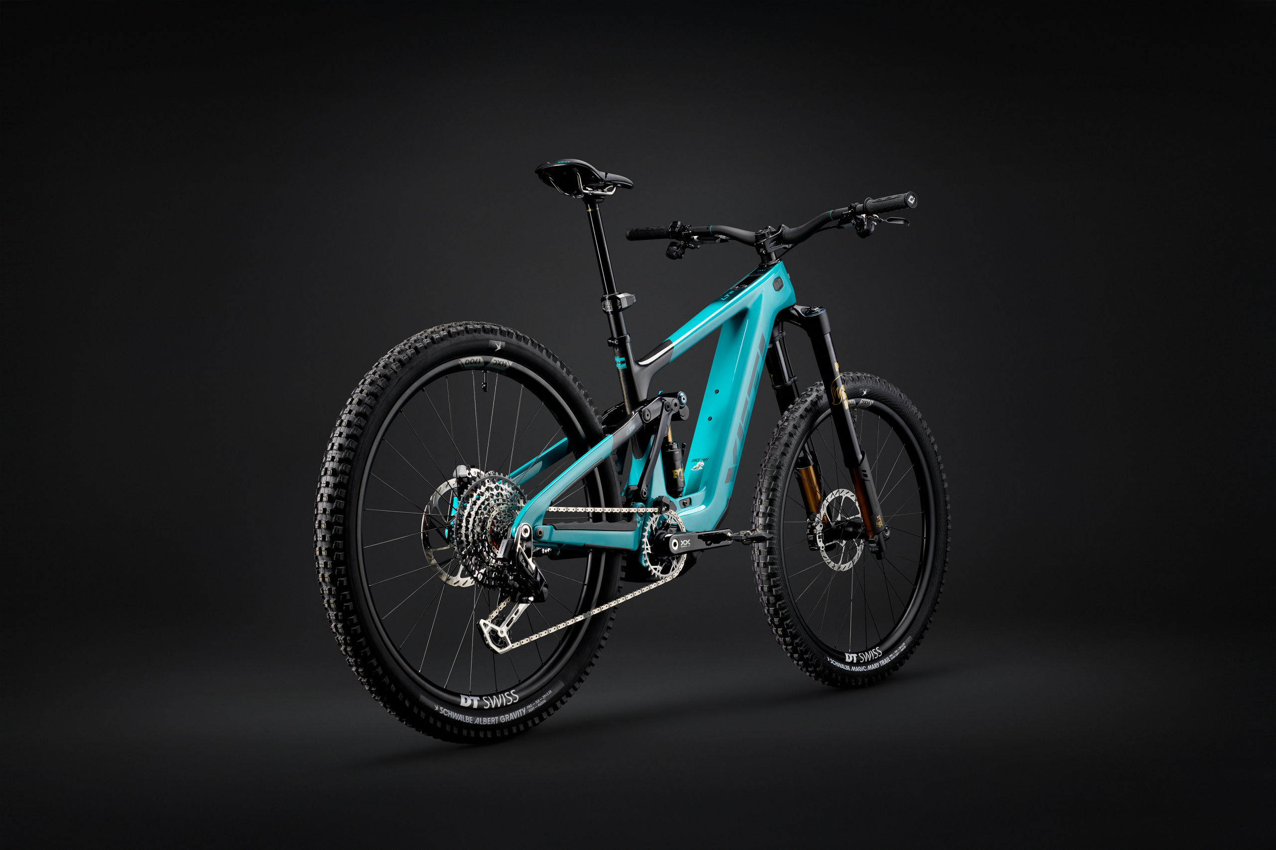 Electric mountain bike with full suspension, teal frame, and DT Swiss wheels, ideal for off-road cycling adventure and rugged terrain. Mountain Bike United.