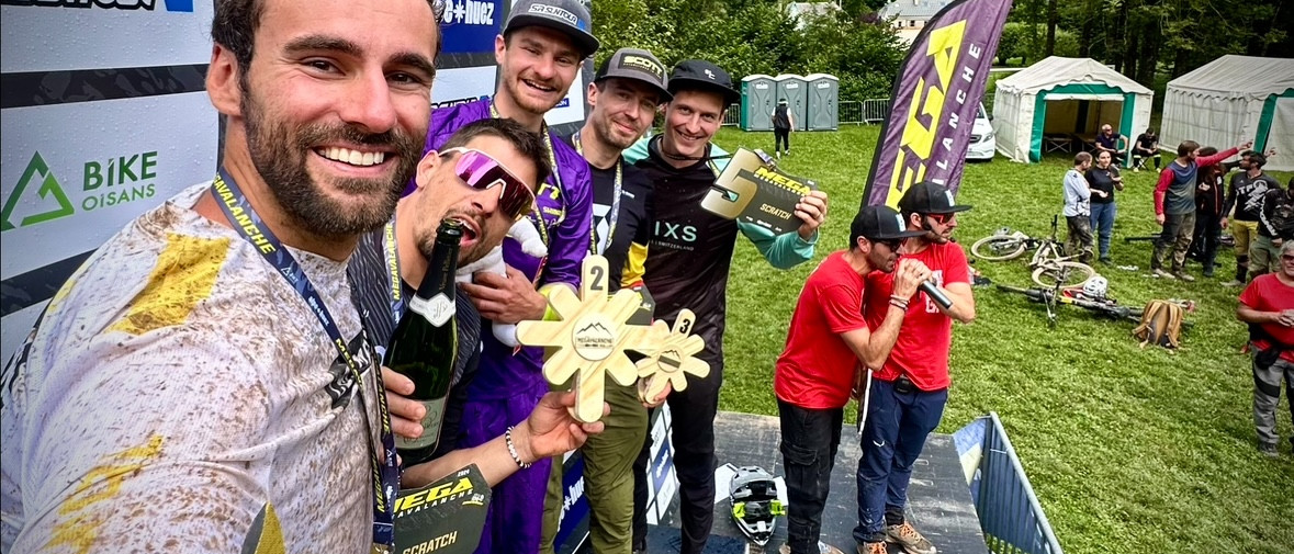 Mountain bike race winners celebrate on the podium with trophies, showcasing the excitement of a successful MTB event. Share MTB news. Mountain Bike United.