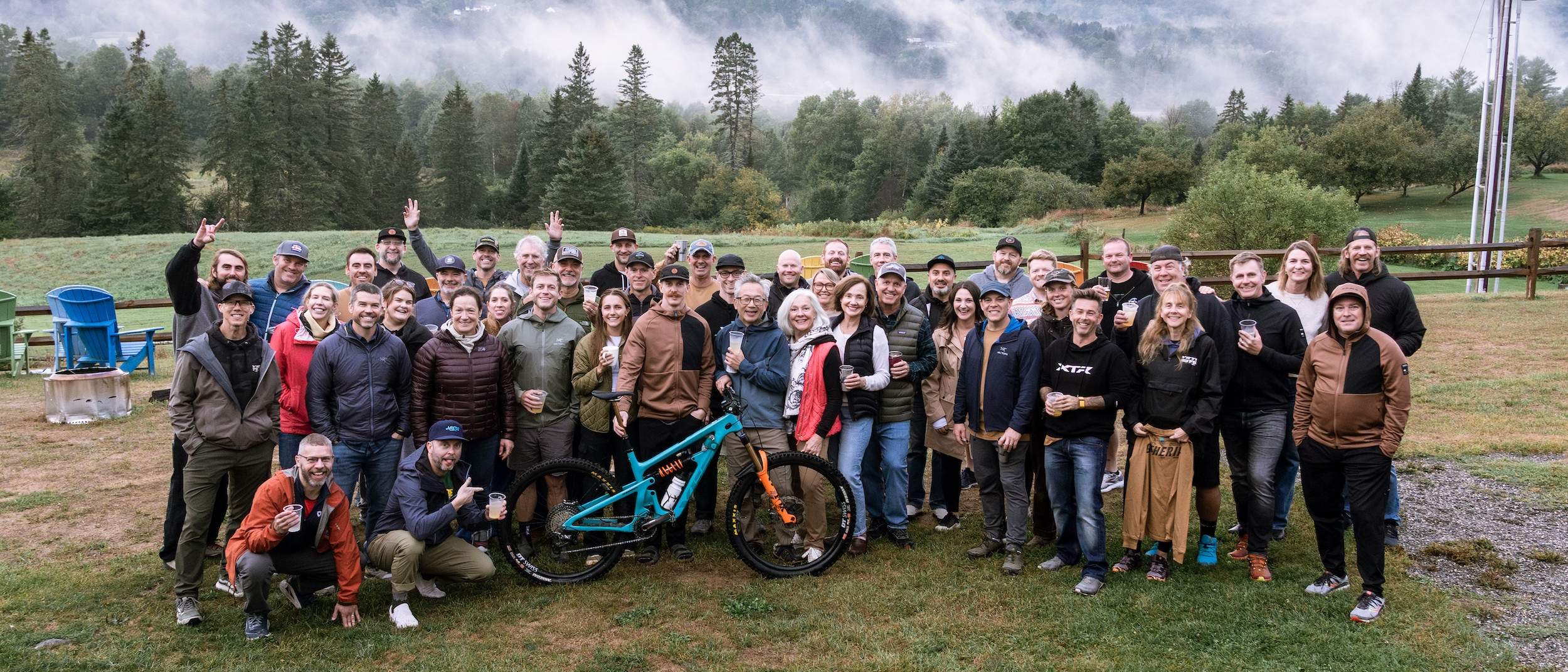 Group photo at Yeti Gathering Vermont 2025 with mountain backdrop and participants enjoying the event. Mountain Bike United.
