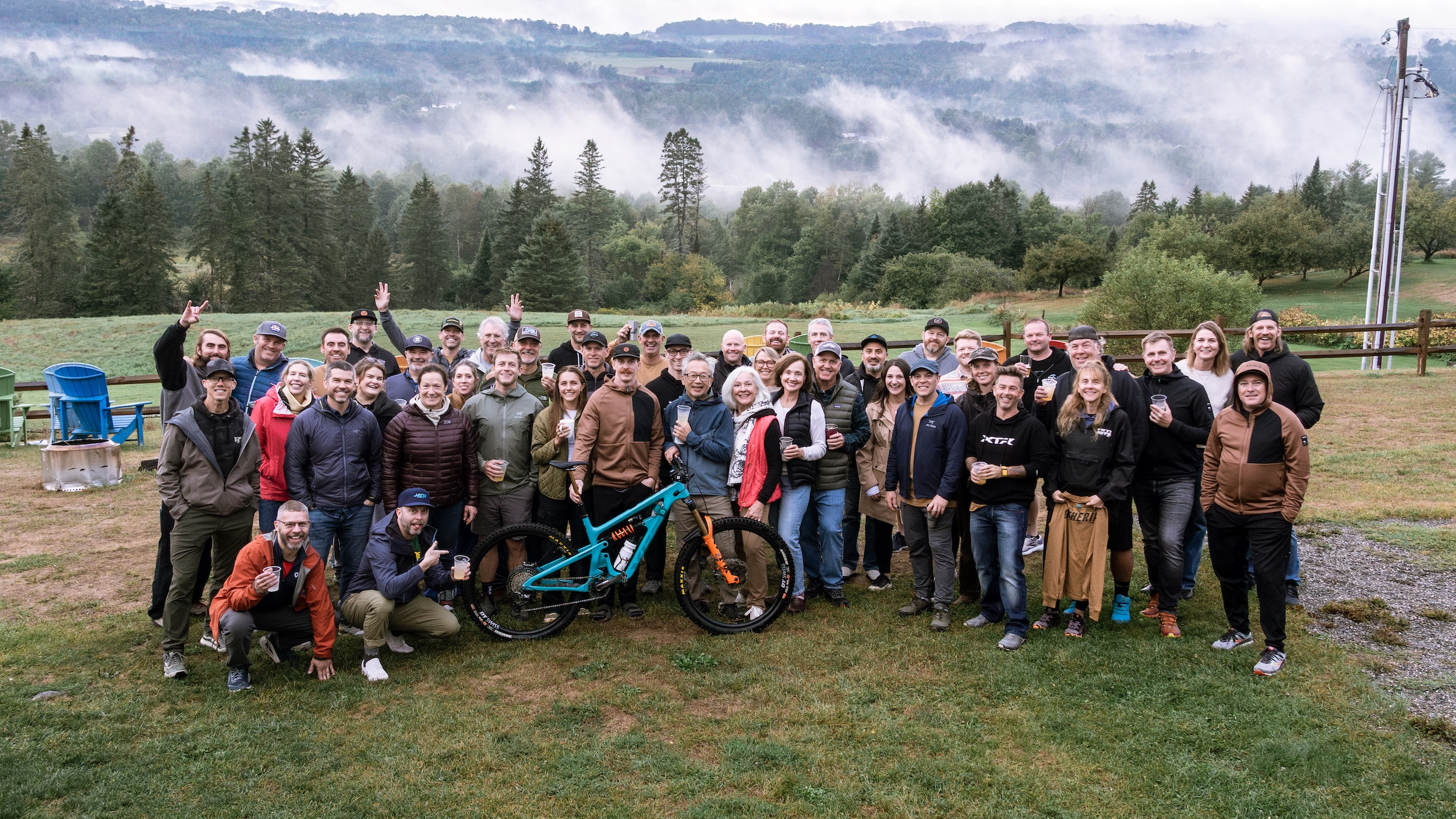 Group photo at Yeti Gathering Vermont 2025 with mountain backdrop and participants enjoying the event. Mountain Bike United.