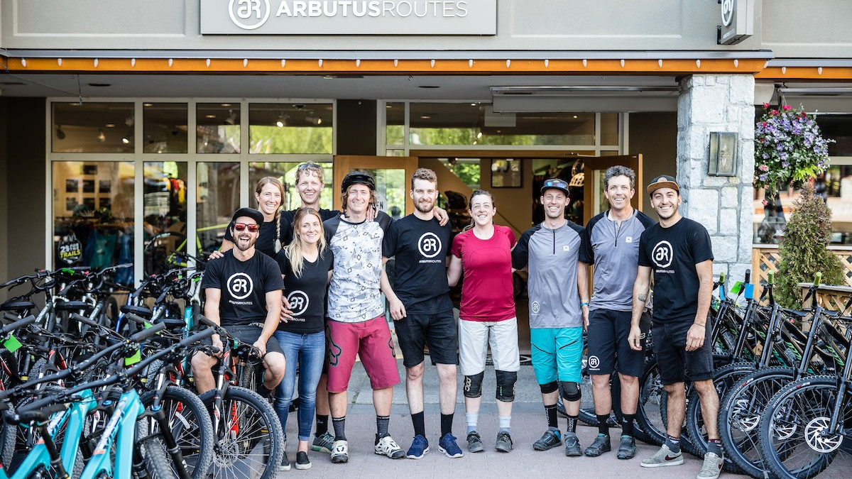 Local MTB services team in front of bike shop ready to assist riders. Mountain Bike United.