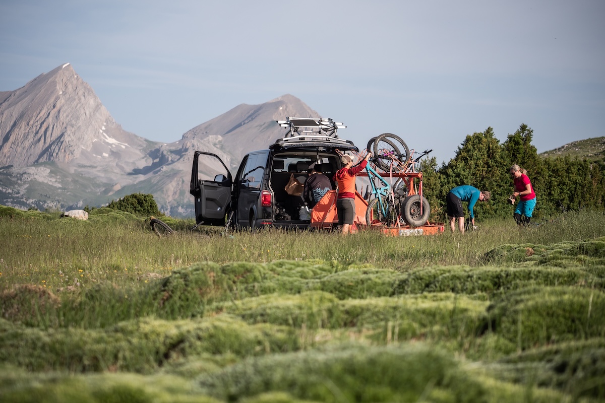 Group unloading mountain bikes from vehicle in Spain, Mountain Bike United