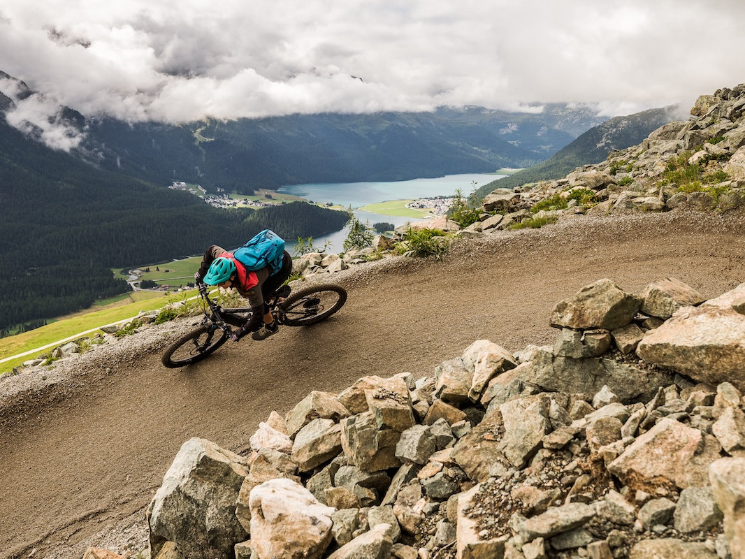 Mountain biker riding well-managed trails in Switzerland, MTB destination management tools